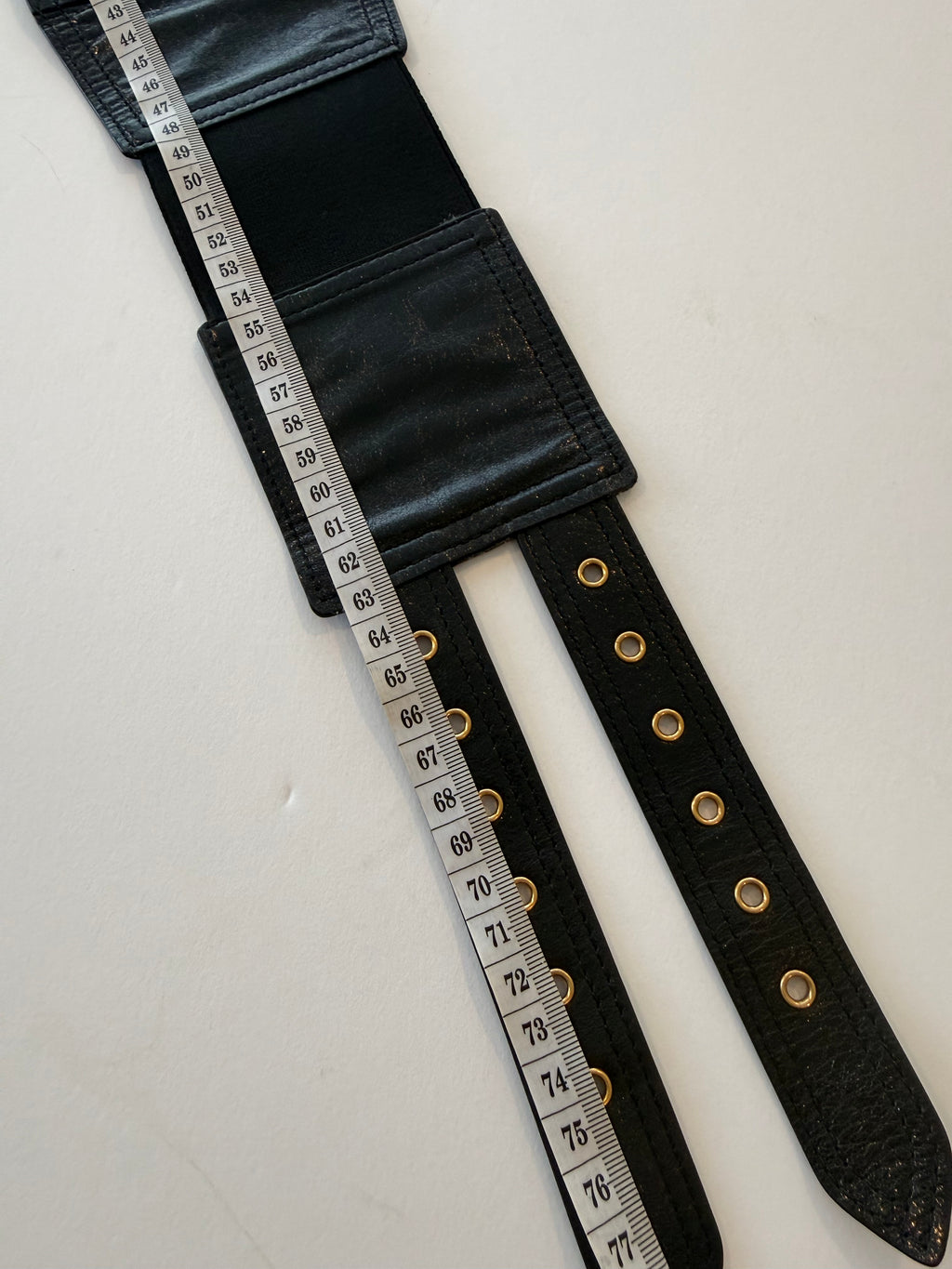 Christian Dior Saddle belt bag in black calfskin with gold-tone D charm and belt strap extended showing belt measurements 65mm-75mm
