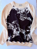 Close-up of the black-and-white Cheval Surprise splatter print on the Hermès knit sweater