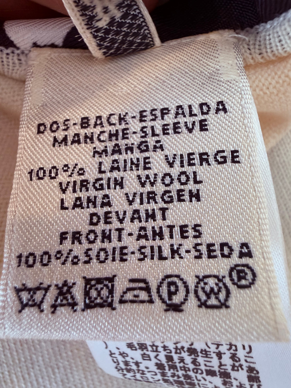 Hermès care label for the Cheval Surprise graphic knit sweater