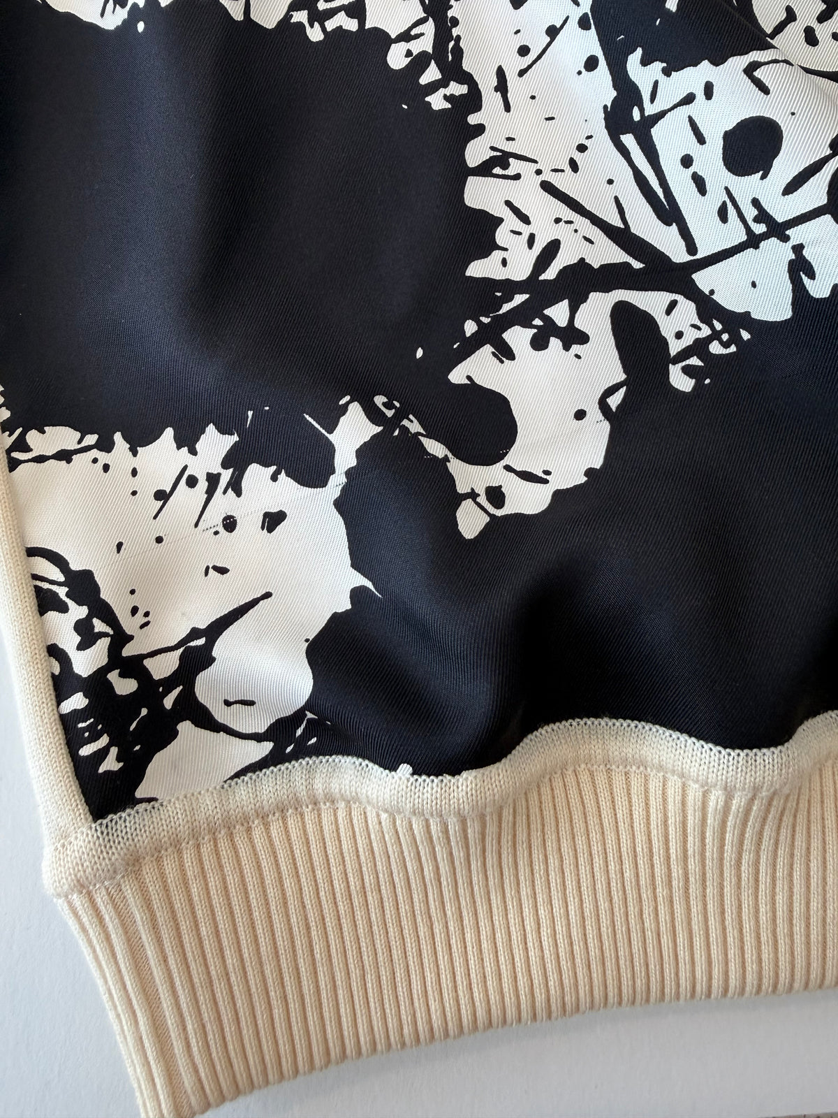 Black-and-white splatter graphic on the Hermès Cheval Surprise sweater