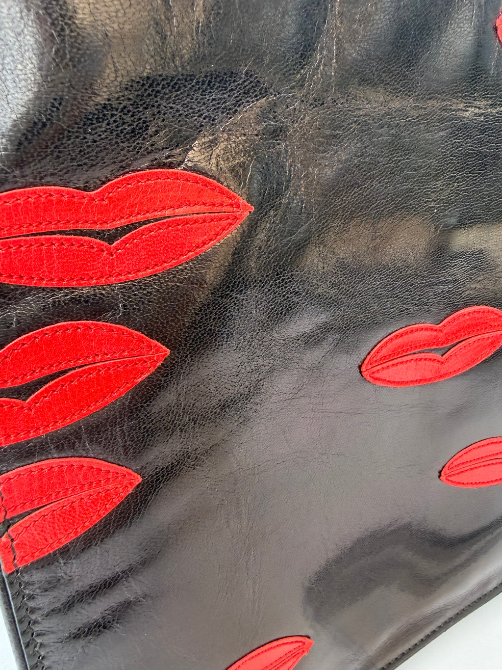 Prada Black Leather Clutch with Red Lip Appliqué