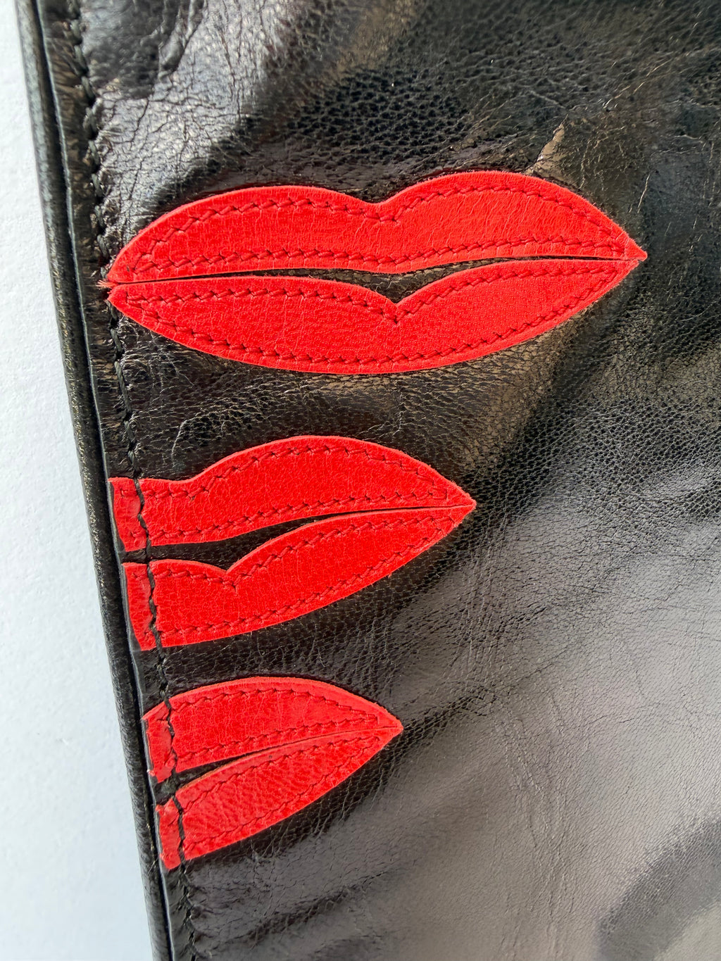 Prada Black Leather Clutch with Red Lip Appliqué