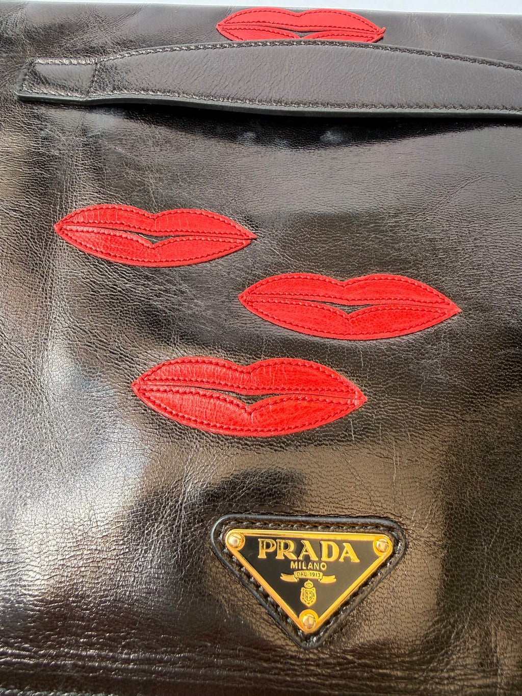 Prada Black Leather Clutch with Red Lip Appliqué